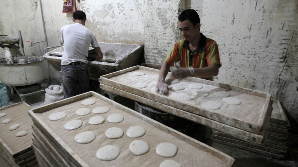 Egyptians are seen working in a bakery in Cairo. The U.S. has been working on ways to help revive the economies of nations in transition, like Egypt, Tunisia and Libya, while having limited resources available during tough economic times.