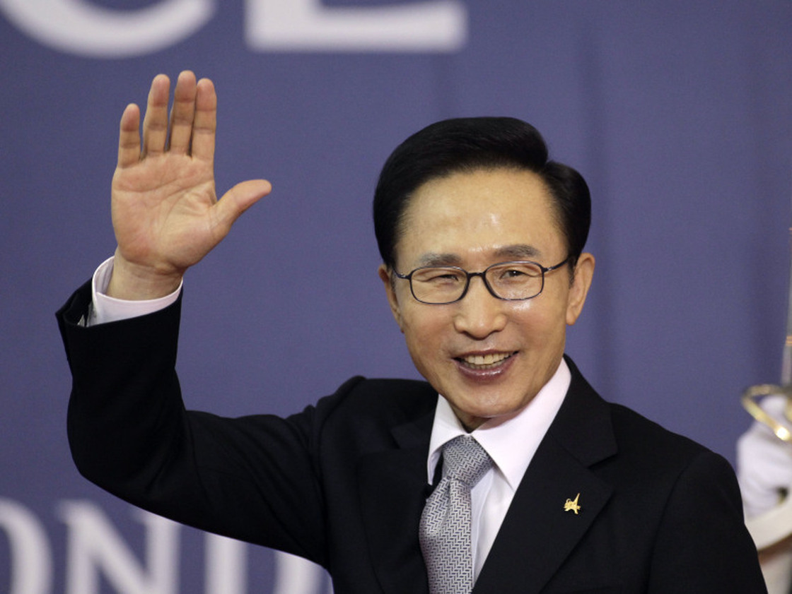 South Korea's President Lee Myung-bak waves as he arrives for a working dinner at the G20 summit in Cannes, southern France, Nov. 3. At home, Lee faces mounting criticism over the free trade deal with the U.S. as well as North Korea policy and the economy.
