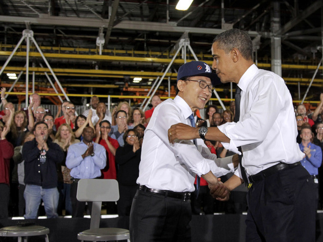 Presidents Obama and Lee embrace after touring and speaking at the General Motors Orion Assembly Plant in Orion Township, Mich., Oct. 14.