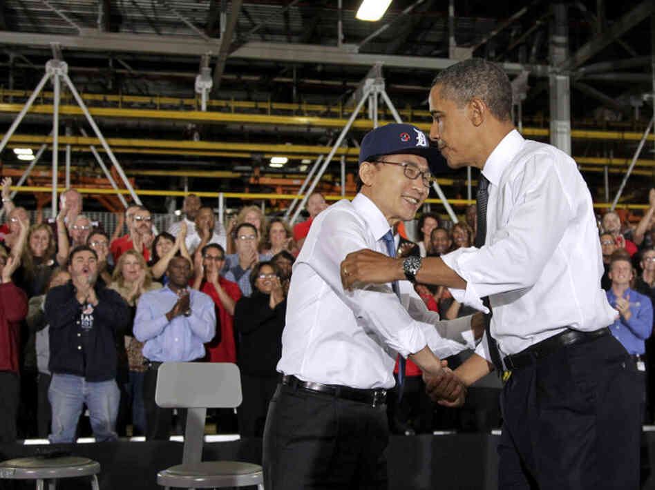 Presidents Obama and Lee embrace after touring and speaking at the General Motors Orion Assembly Plant in Orion Township, Mich., Oct. 14.