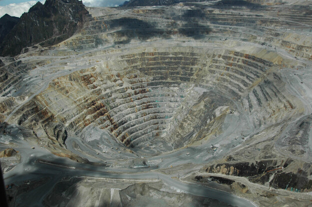 Critics accuse Freeport-McMoRan not only of underpaying workers but also of destroying the environment in remote Papua and of decades of complicity in human rights abuses by the Indonesian military. Here, an aerial photograph of the Grasberg mining complex.
