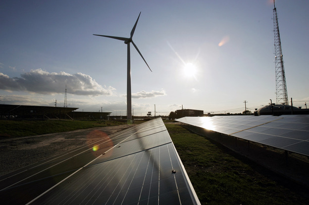 Windmills and solar panels in Atlantic City, N.J., power a wastewater treatment plant, with surplus energy going to the area power grid. Solar and wind energy companies receive $370 million in federal subsidies annually, which is less than 1 percent of what oil and gas industries receive.