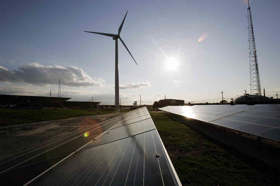 Windmills and solar panels in Atlantic City, N.J., power a wastewater treatment plant, with surplus energy going to the area power grid. Solar and wind energy companies receive $370 million in federal subsidies annually, which is less than 1 percent of what oil and gas industries receive.