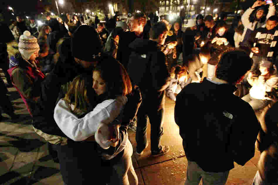 Students embrace after a candlelight vigil on the Penn State campus Friday, in State College, Pa. The vigil was held in support of victims of child sexual abuse amid a scandal involving former assistant football coach Jerry Sandusky. Students embrace after a candlelight vigil on the Penn State campus Friday, in State College, Pa. The vigil was held in support of victims of child sexual abuse amid a scandal involving former assistant football coach Jerry Sandusky.
