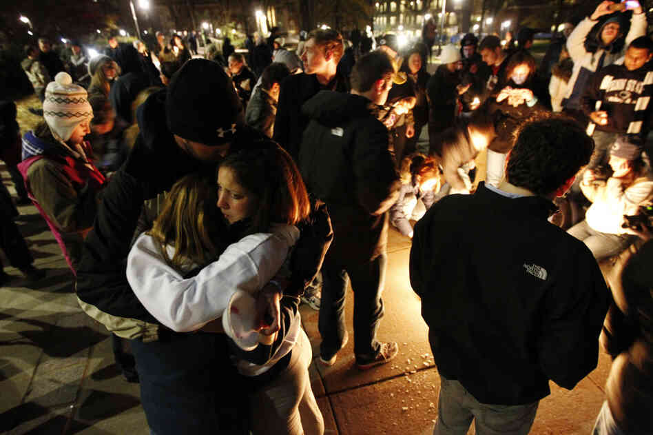 Students embrace after a candlelight vigil on the Penn State campus Friday, in State College, Pa. The vigil was held in support of victims of child sexual abuse amid a scandal involving former assistant football coach Jerry Sandusky. Students embrace after a candlelight vigil on the Penn State campus Friday, in State College, Pa. The vigil was held in support of victims of child sexual abuse amid a scandal involving former assistant football coach Jerry Sandusky.