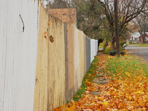 Garcia's fence, which spans several lots and almost an entire block, runs corner to corner. Garcia's fence, which spans several lots and almost an entire block, runs corner to corner.