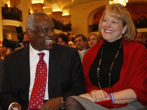 Supreme Court Justice Clarence Thomas sits with his wife Virginia Thomas, as he is introduced at the Federalist Society in Washington on Nov. 15, 2007. Supreme Court Justice Clarence Thomas sits with his wife Virginia Thomas, as he is introduced at the Federalist Society in Washington on Nov. 15, 2007.