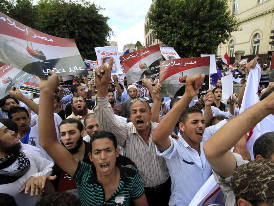 Demonstrators from a Salafi group chant slogans and hold posters that read, in Arabic, "Islamic Egypt," during a Sept. 23 protest against emergency law in Cairo. Salafi political parties will be among those vying in upcoming elections.
