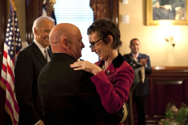 Giffords hugs Kelly on Oct. 6 in the White House after Kelly received the Legion of Merit medal during his retirement ceremony.