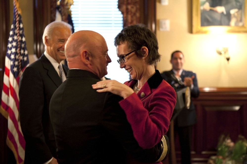 Giffords hugs Kelly on Oct. 6 in the White House after Kelly received the Legion of Merit medal during his retirement ceremony.