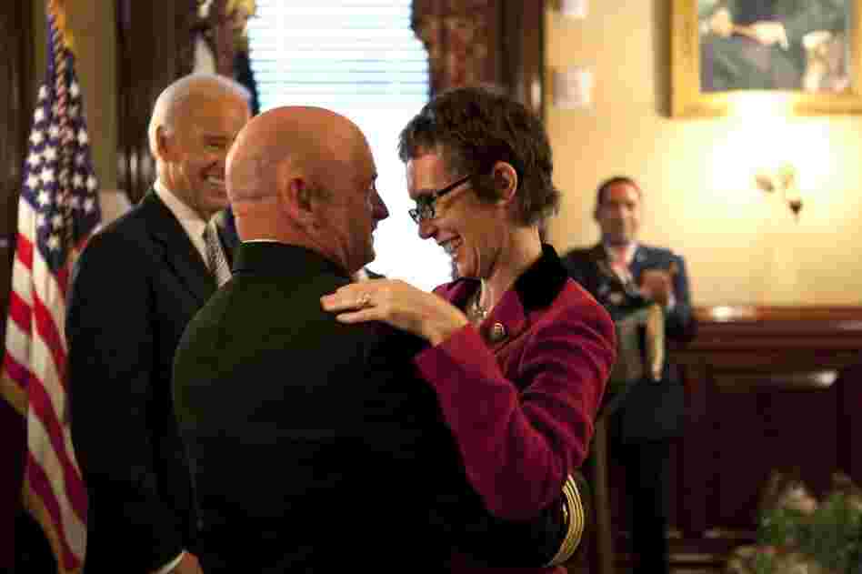 Giffords hugs Kelly on Oct. 6 in the White House after Kelly received the Legion of Merit medal during his retirement ceremony.