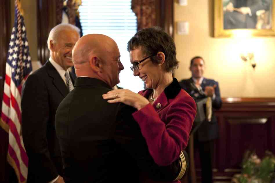 Giffords hugs Kelly on Oct. 6 in the White House after Kelly received the Legion of Merit medal during his retirement ceremony.