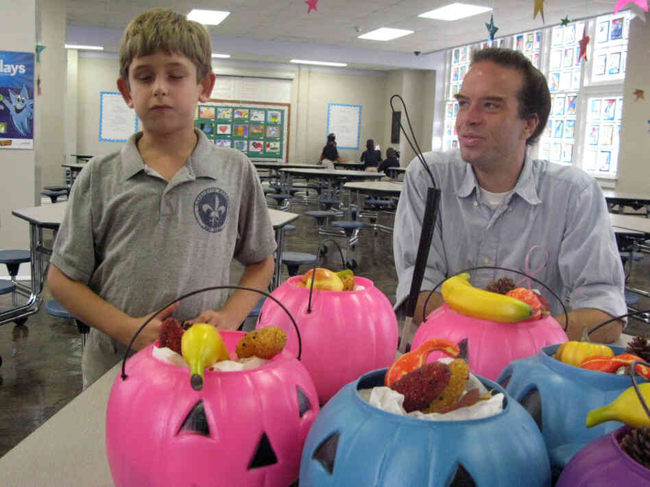 Noah Fisher, 10, and his full-time aide, Daniel Thomas, at Lafayette Academy, a charter school housed in a former district school building in New Orleans. 