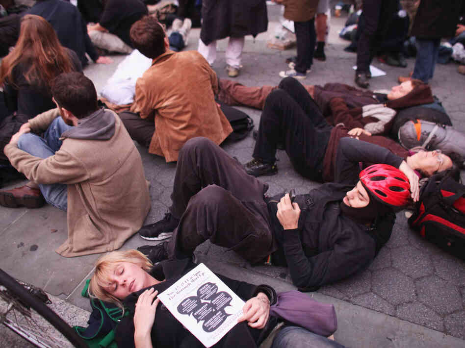  Occupy Wall Street protesters regroup in Foley Square after New York City police in riot gear removed the protesters from Zuccotti Park early Tuesday. The evacuation followed similar moves in Oakland, Calif., and Portland, Ore. 