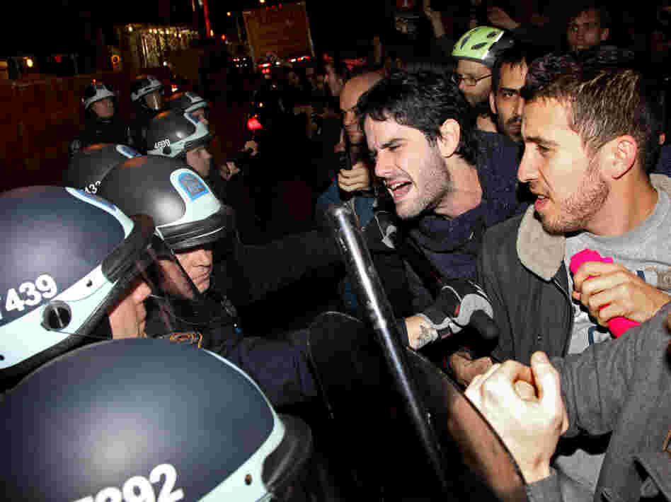 Occupy Wall Street protesters clash with police at Manhattan's Zuccotti Park after New York police officers ordered them to leave their longtime encampment.