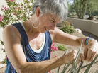 Suzi Hileman inspects an aloe on her front porch on Wednesday, Aug. 24. Suzi Hileman inspects an aloe on her front porch on Wednesday, Aug. 24.