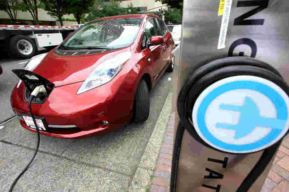 A Nissan Leaf charges at a station in Portland, Ore., that can recharge an electric car in 30 minutes. Electric cars could be an integral part of meeting 55-mpg fuel standards by 2025, but many consumers are put off by the vehicles' higher price and what some call "range anxiety." A Nissan Leaf charges at a station in Portland, Ore., that can recharge an electric car in 30 minutes. Electric cars could be an integral part of meeting 55-mpg fuel standards by 2025, but many consumers are put off by the vehicles' higher price and what some call "range anxiety."