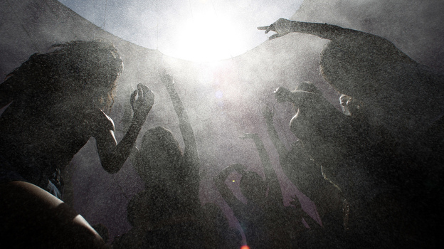 Concertgoers move in a spray of cooling mist as they dance amid the heat of the desert at the hipster Coachella Valley Music & Arts Festival in Indio, Calif., in April. Concertgoers move in a spray of cooling mist as they dance amid the heat of the desert at the hipster Coachella Valley Music & Arts Festival in Indio, Calif., in April.