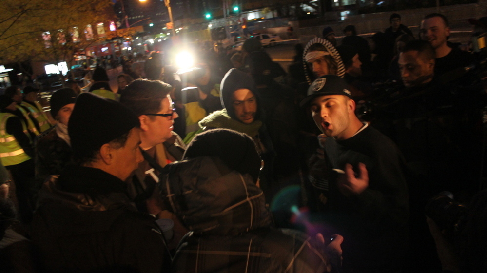 Occupy protesters argue with a passerby. 