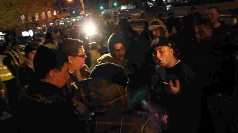 Occupy protesters argue with a passerby. 