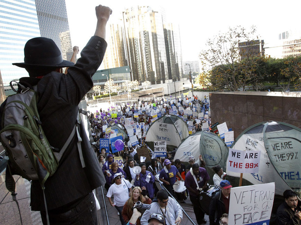 Occupy protesters march through buildings during a rally in Los Angeles, one of several nationwide on Thursday.