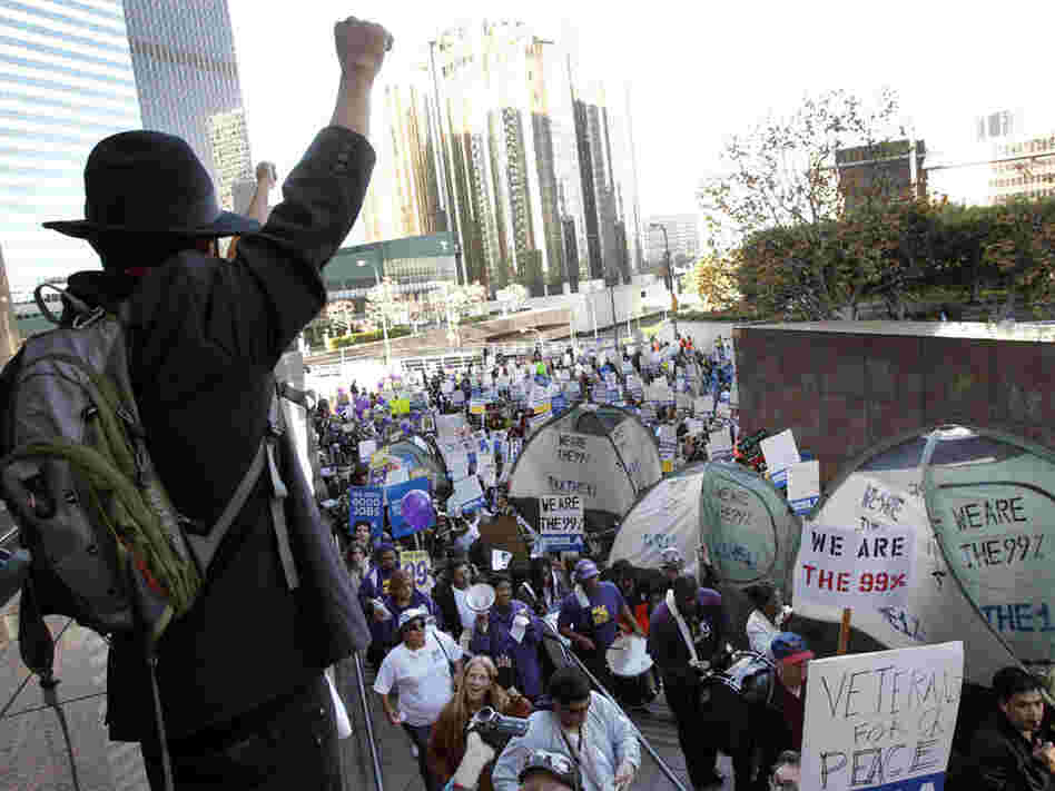 Occupy protesters march through buildings during a rally in Los Angeles, one of several nationwide on Thursday.
