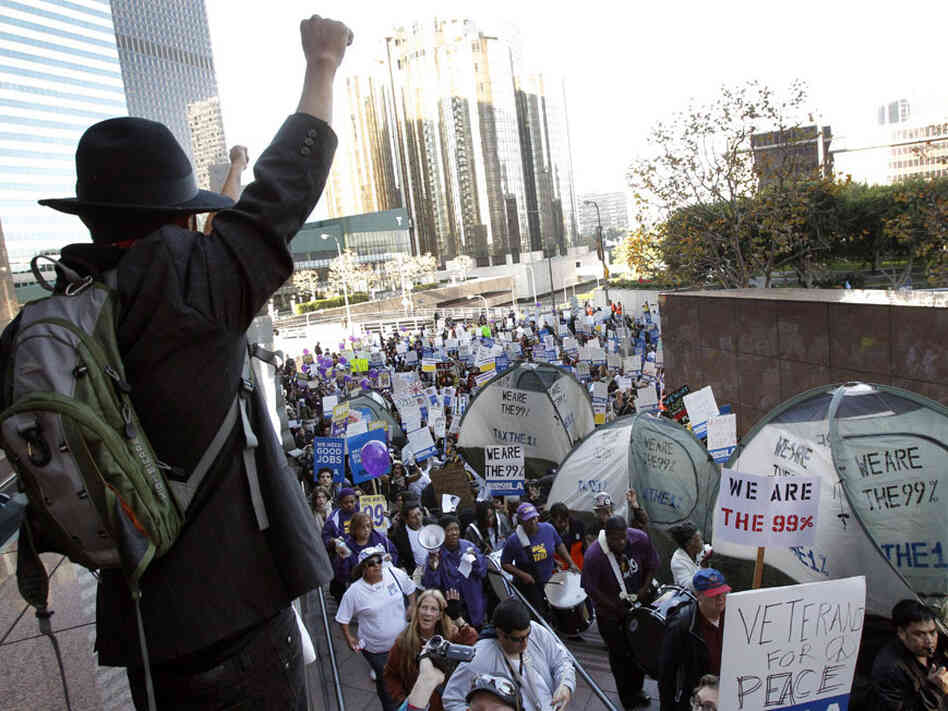 Occupy protesters march through buildings during a rally in Los Angeles, one of several nationwide on Thursday.