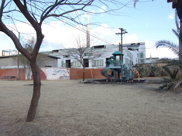 The Asarco copper smelter in Arizona looms behind a playground at the Hayden City Park.