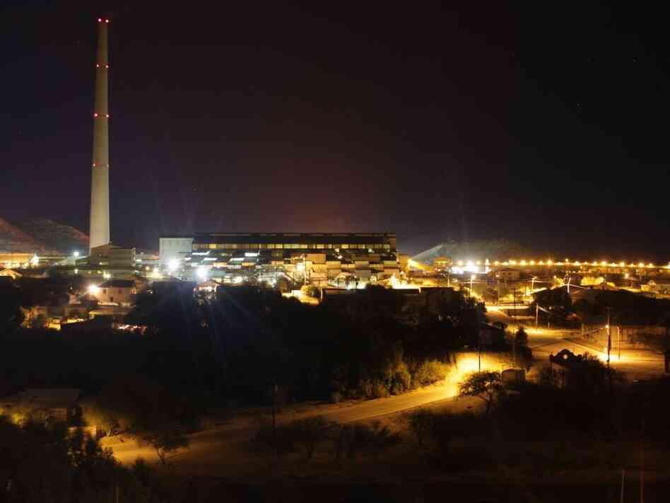 A haze can be seen at night hovering over the Asarco copper smelter, which turns copper ore into nearly pure copper bars.