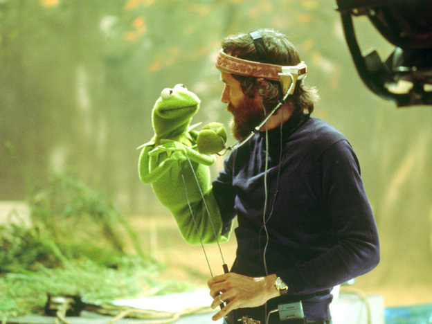 Like Muppets creator Jim Henson (with Kermit, above, in the 1970s), current Muppeteers (including Bill Barretta, below, with Pepe the Prawn) wear head-mounted microphones to capture their voice work. 