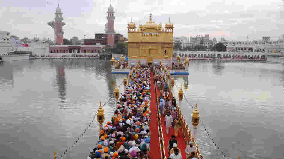 Sikh pilgrims stream into the Golden Temple in Amritsar, India, on Nov. 10. Devout Sikhs from all over India and the world come to Amritsar by the tens of thousands every day â adding to an already sizable carbon footprint. So city and temple officials have joined an environmental group to learn how to incorporate environmentally friendly practices. Sikh pilgrims stream into the Golden Temple in Amritsar, India, on Nov. 10. Devout Sikhs from all over India and the world come to Amritsar by the tens of thousands every day â adding to an already sizable carbon footprint. So city and temple officials have joined an environmental group to learn how to incorporate environmentally friendly practices.