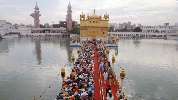 Sikh pilgrims stream into the Golden Temple in Amritsar, India, on Nov. 10. Devout Sikhs from all over India and the world come to Amritsar by the tens of thousands every day ΓΆ€” adding to an already sizable carbon footprint. So city and temple officials have joined an environmental group to learn how to incorporate environmentally friendly practices. Sikh pilgrims stream into the Golden Temple in Amritsar, India, on Nov. 10. Devout Sikhs from all over India and the world come to Amritsar by the tens of thousands every day ΓΆ€” adding to an already sizable carbon footprint. So city and temple officials have joined an environmental group to learn how to incorporate environmentally friendly practices.
