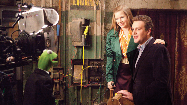 Anchorphibian: Kermit the Frog does the backstage-chat thing with Amy Adams and Jason Segel in The Muppets.