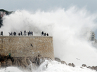 A U.N. climate panel says that we can expect more extreme weather conditions as a result of climate change. Above, people run from a high wave on Nov. 8 in Nice, France, where heavy rain and flooding forced hundreds to evacuate. A U.N. climate panel says that we can expect more extreme weather conditions as a result of climate change. Above, people run from a high wave on Nov. 8 in Nice, France, where heavy rain and flooding forced hundreds to evacuate.