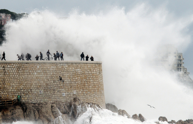 A U.N. climate panel says that we can expect more extreme weather conditions as a result of climate change. Above, people run from a high wave on Nov. 8 in Nice, France, where heavy rain and flooding forced hundreds to evacuate. A U.N. climate panel says that we can expect more extreme weather conditions as a result of climate change. Above, people run from a high wave on Nov. 8 in Nice, France, where heavy rain and flooding forced hundreds to evacuate.