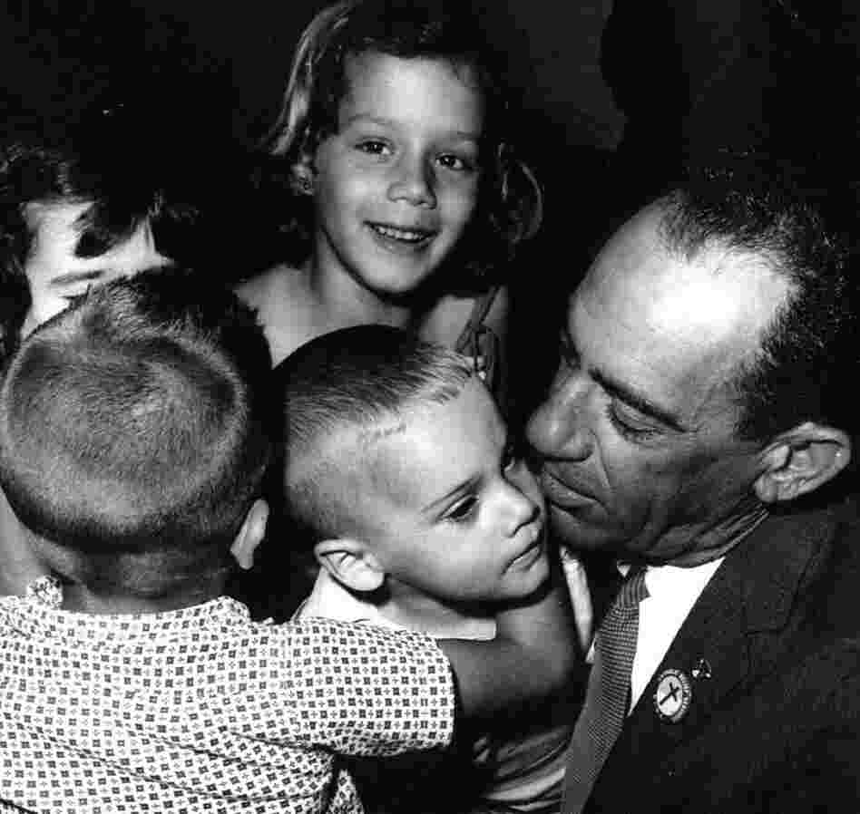 At Miami's airport, children from Cuba meet George Guarch, who worked for the Catholic Welfare Bureau in the city. Guarch took displaced children to temporary camps in Miami.