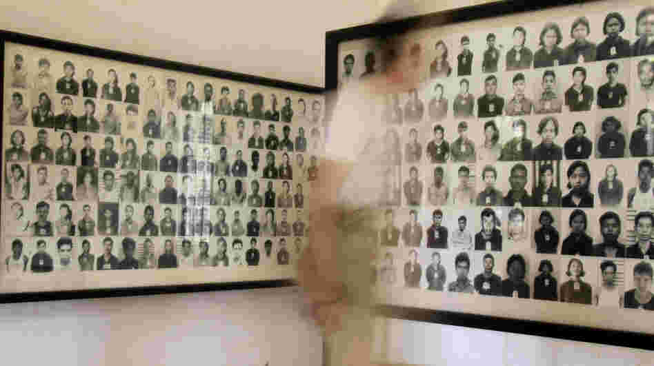 A tourist views photos of former Khmer Rouge prisoners at the Tuol Sleng genocide museum, formerly the regime's notorious S-21 prison, in Phnom Penh, Cambodia, in a photo from 2009. 