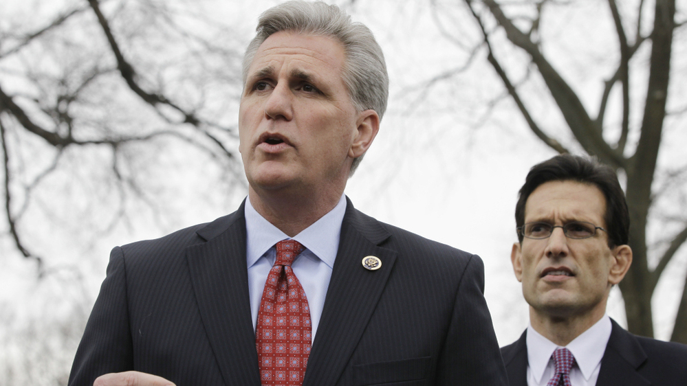  Rep. Kevin McCarthy (foreground), the No. 3 Republican in the House, speaks while Majority Leader Eric Cantor listens. McCarthy has made it clear that he wants the health overhaul law repealed. But conservative lawmakers in his hometown of Bakersfield, Calif., are accepting federal money to expand Medicaid.  
