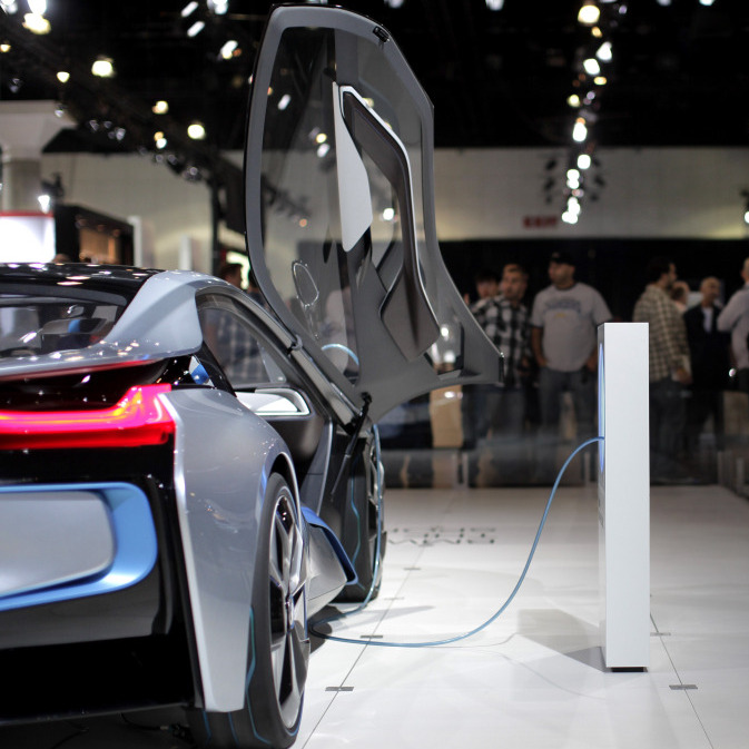 Attendees at the Los Angeles Auto Show look at the BMW i8 plug-in hybrid concept car. Toyota's Prius is the best-selling hybrid on the market, but almost every carmaker has some form of hybrid technology.