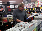 Timmons browses the racks of his now-closed business. The record store will have a final clearance sale on Nov. 29. Timmons browses the racks of his now-closed business. The record store will have a final clearance sale on Nov. 29.