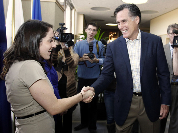 Mitt Romney greets BAE Systems employee Ashley Bournival in Nashua, N.H., Monday, Nov. 21, 2011. 