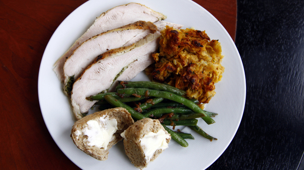 Chris Kimball uses "secret" ingredients to make his Thanksgiving dishes special, including herb roasted turkey, green beans, corn-flake stuffing and multigrain rolls. And for dessert, he made a spiced pumpkin cheesecake. 