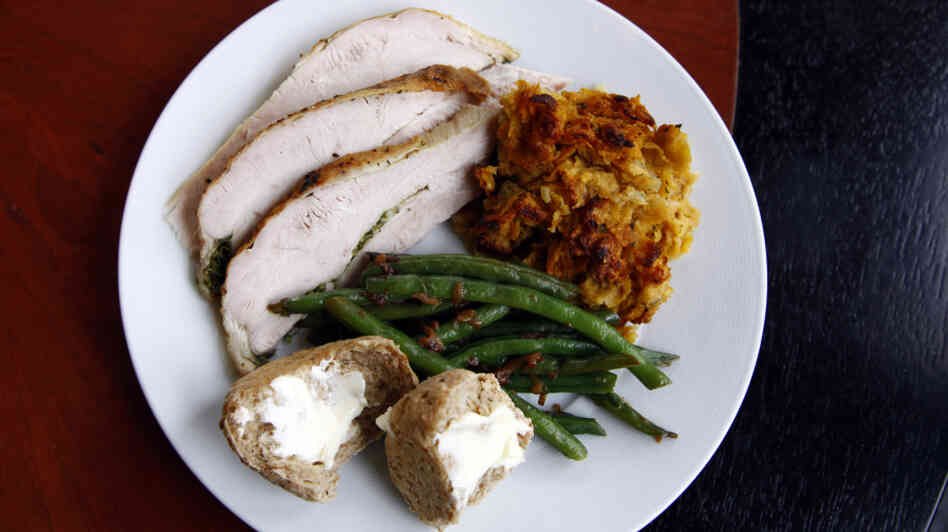 Chris Kimball uses "secret" ingredients to make his Thanksgiving dishes special, including herb roasted turkey, green beans, corn-flake stuffing and multigrain rolls. And for dessert, he made a spiced pumpkin cheesecake. 