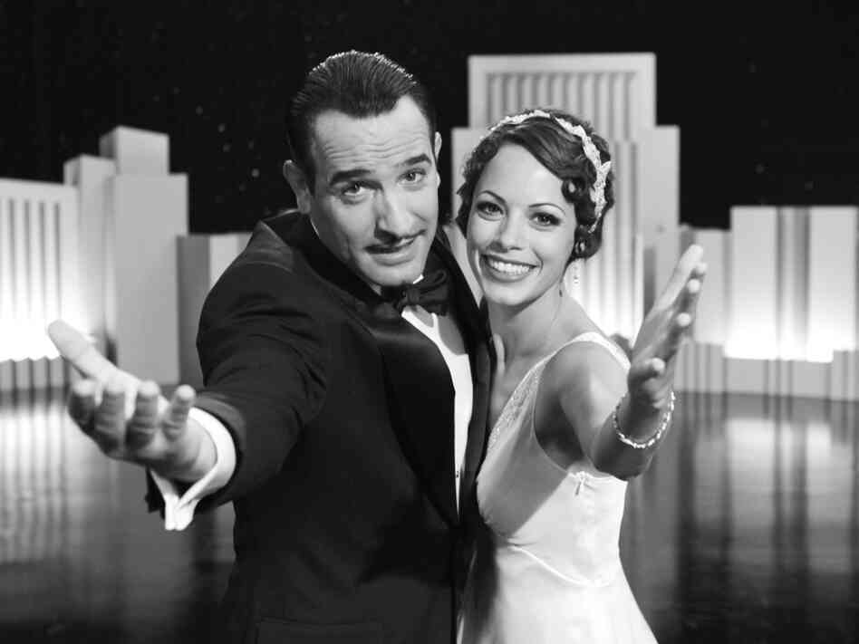 Silent Screen idol George Valentin (Jean Dujardin) and Peppy Miller (Berenice Bejo), a young and upcoming dancer, share a vivacious moment on stage in Michel Hazanavicius's film The Artist.  