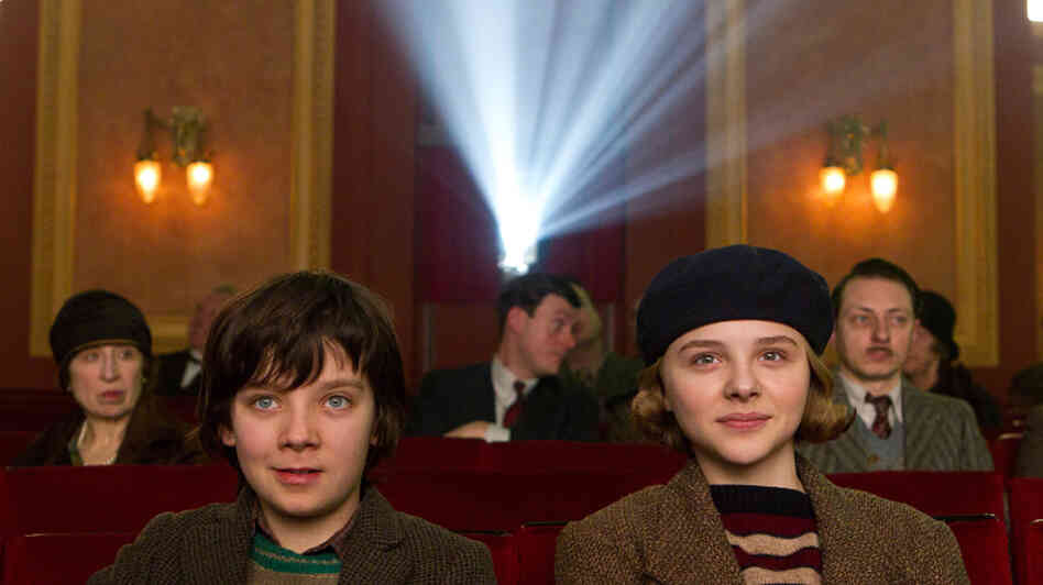 Orphan Hugo Cabret (Asa Butterfield and his vivacious new friend Isabelle (Chloe Grace Moretz) marvel at the magic of the motion picture in Hugo. Orphan Hugo Cabret (Asa Butterfield and his vivacious new friend Isabelle (Chloe Grace Moretz) marvel at the magic of the motion picture in Hugo.
