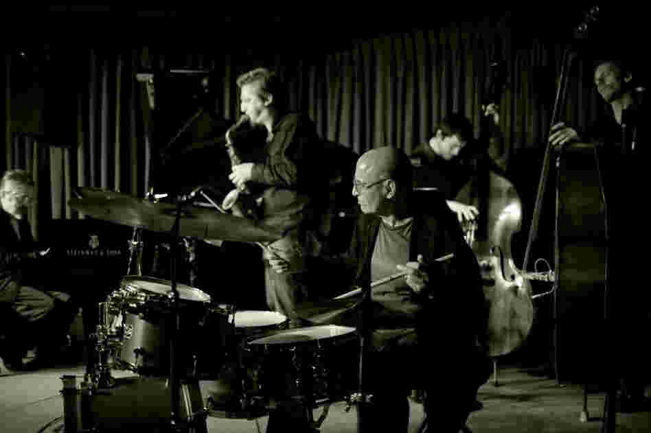 Paul Motian with his Trio 2000 + 2, at the Village Vanguard. L-R: Masabumi Kikuchi, Loren Stillman, Motian, Thomas Morgan, Ben Street. Paul Motian with his Trio 2000 + 2, at the Village Vanguard. L-R: Masabumi Kikuchi, Loren Stillman, Motian, Thomas Morgan, Ben Street.