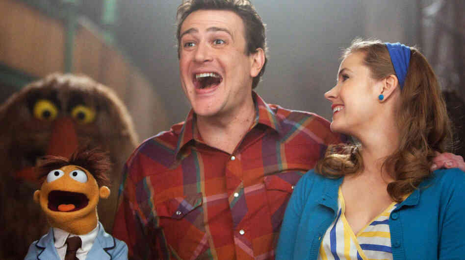 Superfans: Gary (Jason Segel), Mary (Amy Adams) and Gary's brother Walter (the one in felt) set out to tour the Muppet Theater, only to discover that it's in danger of demolition. Superfans: Gary (Jason Segel), Mary (Amy Adams) and Gary's brother Walter (the one in felt) set out to tour the Muppet Theater, only to discover that it's in danger of demolition.
