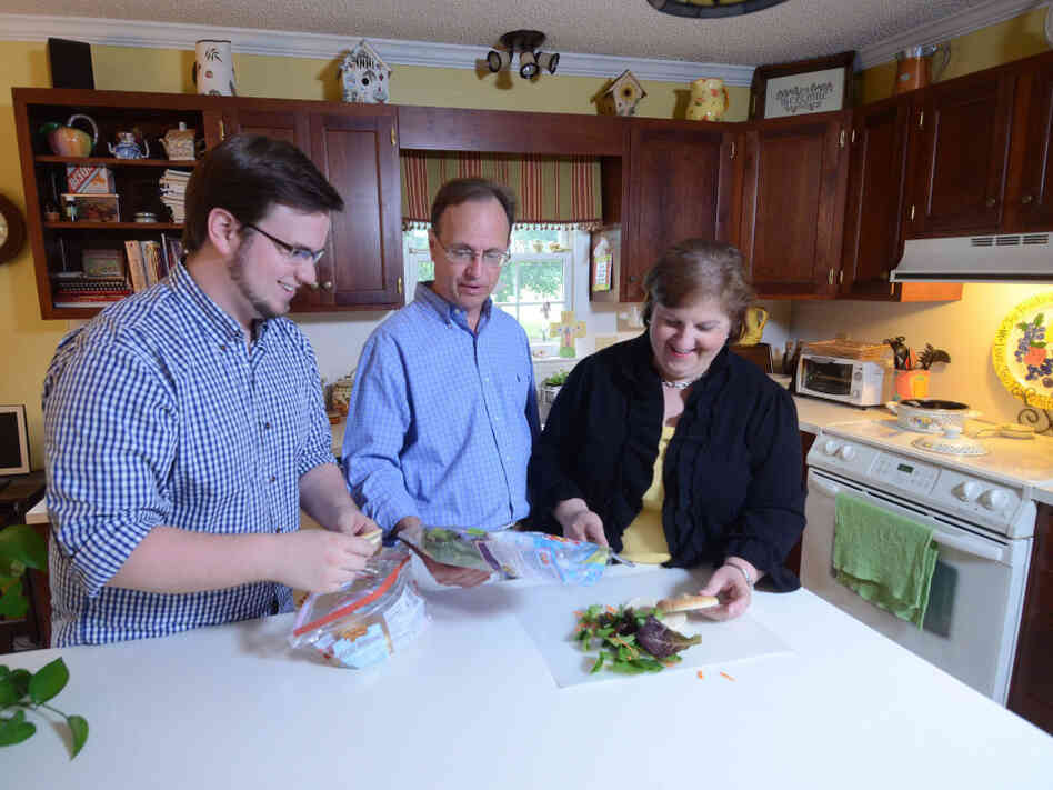 Brian Griffith (left), shown here in 2009 at age 26, moved home with his parents, Jay and Jennifer Griffith, after losing his job. The tight job market, especially for college grads, has prompted many young adults to move back in with their parents.