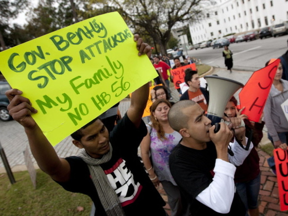 Protesters march outside the Alabama Capitol during a demonstration against the state's immigration law in Montgomery, Ala., on Nov. 15. 