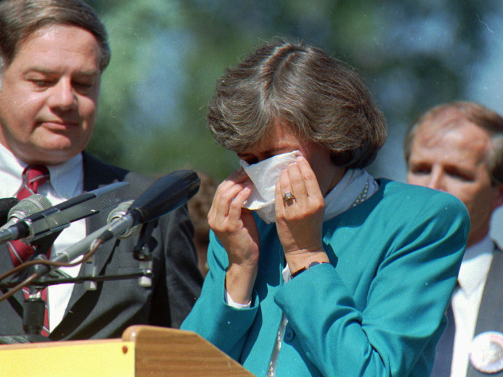 U.S. Rep. Patricia Schroeder wipes her eyes at a 1987 news conference in Denver.